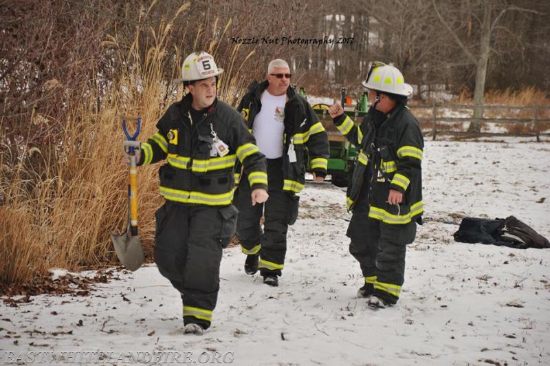 EW Deputy Chief Mark Koenig, Career FF Tom Renfroe, and Career Deputy Chief Matt Fink returning to the engine after horse rescue. Photo courtesy of Nozzle Nut Photography.